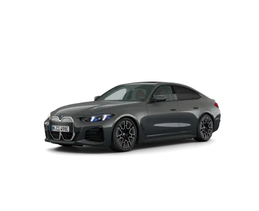 Dark gray luxury sports sedan shown in a front three-quarter view, featuring a large vertical kidney grille, sharp LED headlights, sculpted body panels, black multi-spoke alloy wheels, and a sleek fastback-style roofline against a black background.